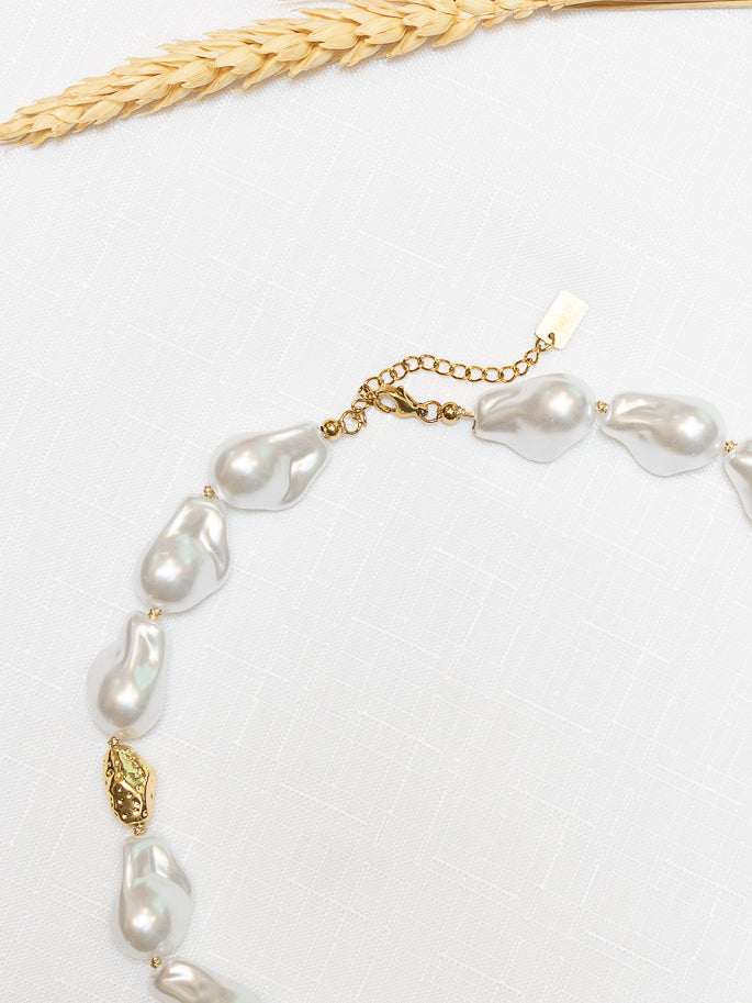 Golden pearl necklace