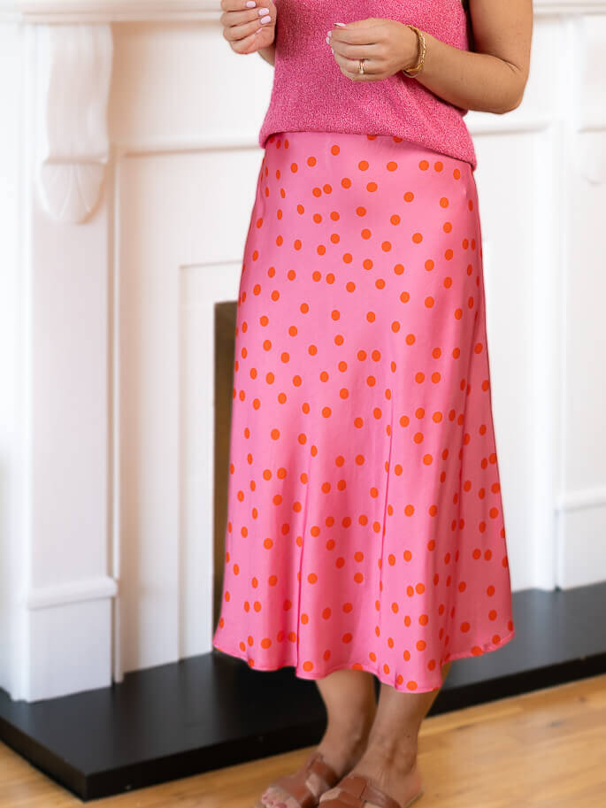 Pink polka dot satin skirt.