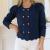 Navy cardigan with gold buttons down front,